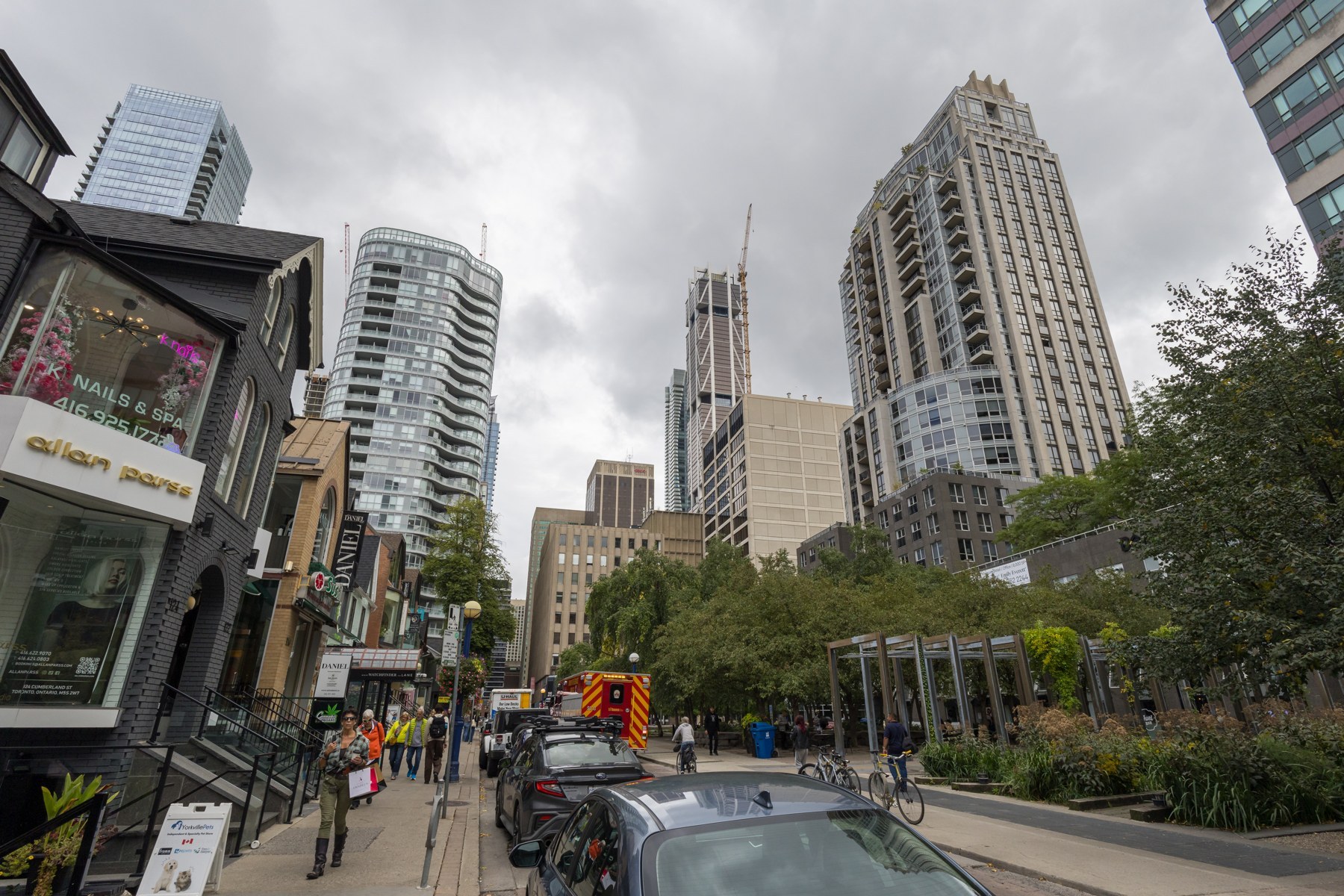 Cumberland Street in Toronto’s Yorkville neighbourhood, with storefronts, trees and condominium buildings